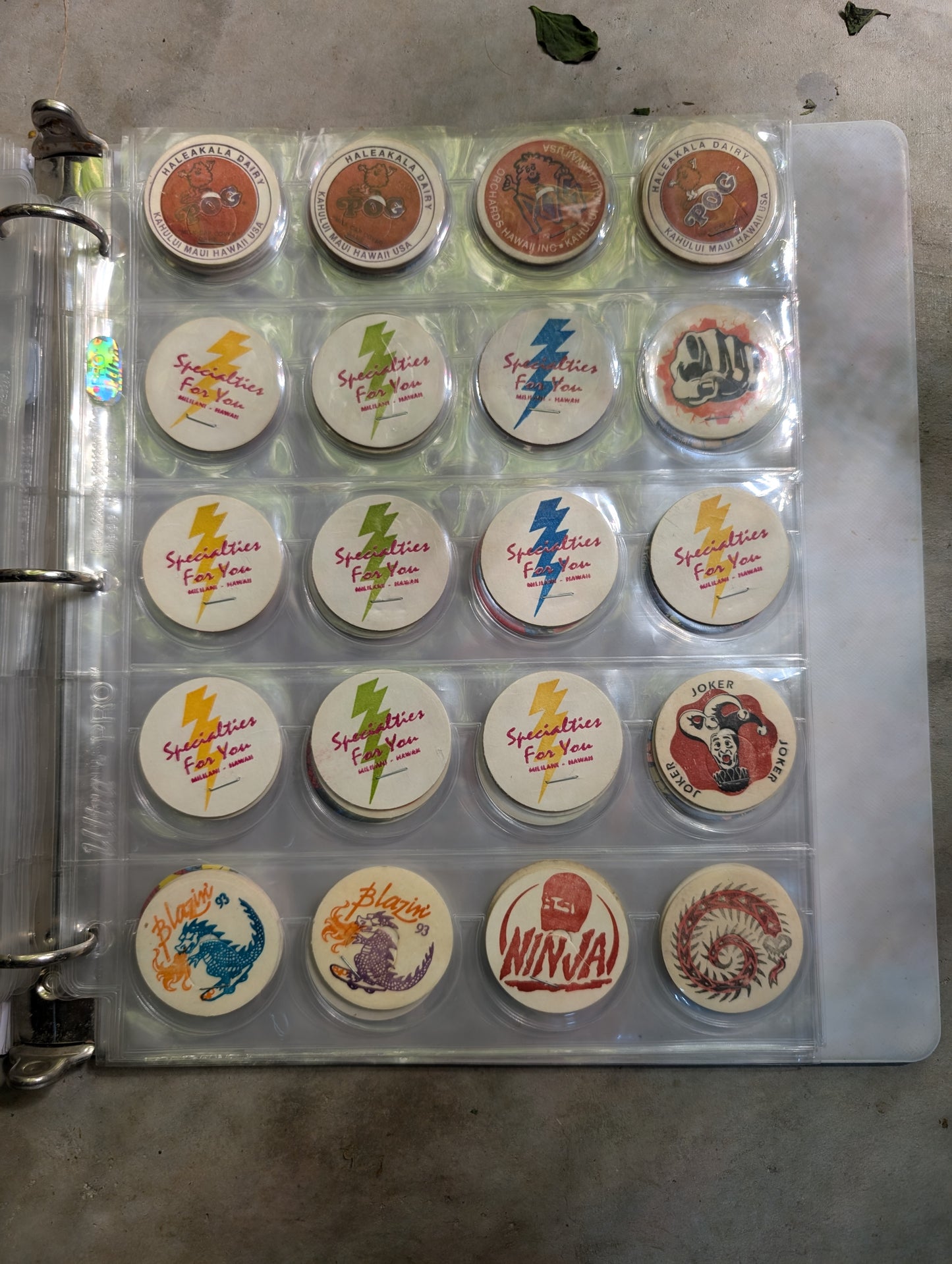 Page of vintage Hawaiian Pogs